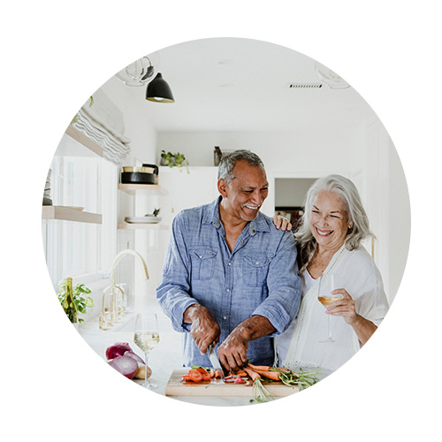 Senior couples eating and cooking veggies