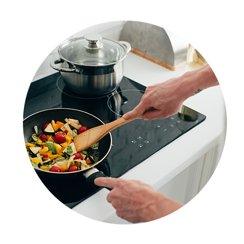 Woman cooking veggies